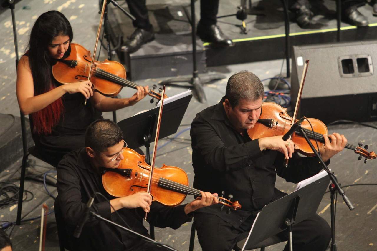 viola shoulder rests - 3 people in orchestra playing viola